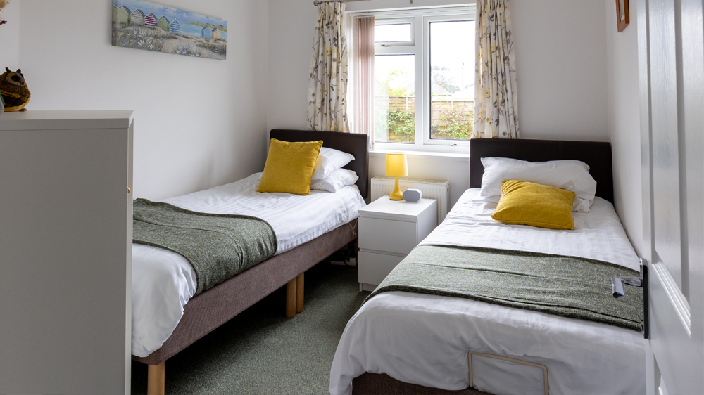 a second view of the twin Bedroom looking towards the window